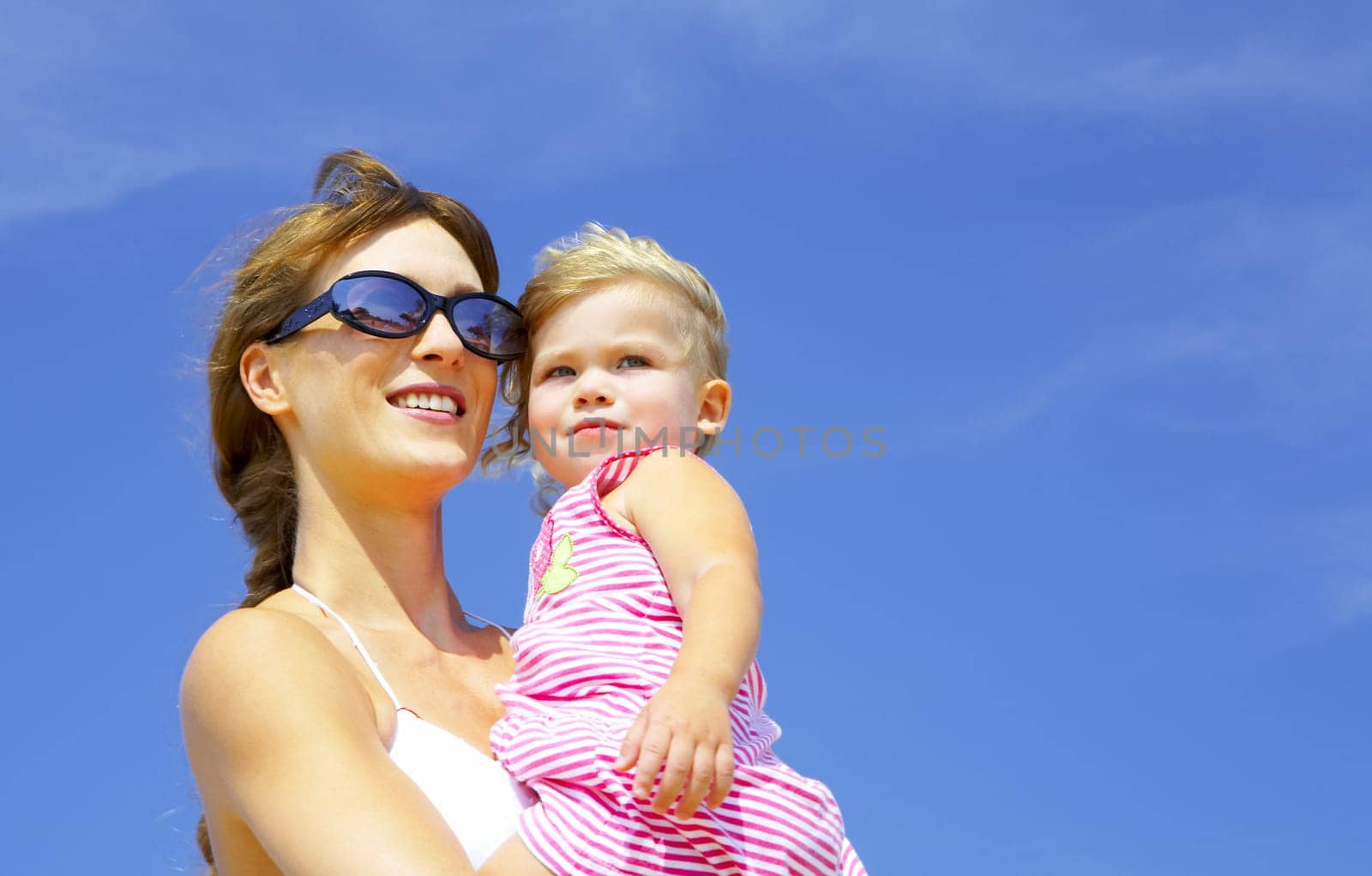 portrait of young happy mother holding her  baby