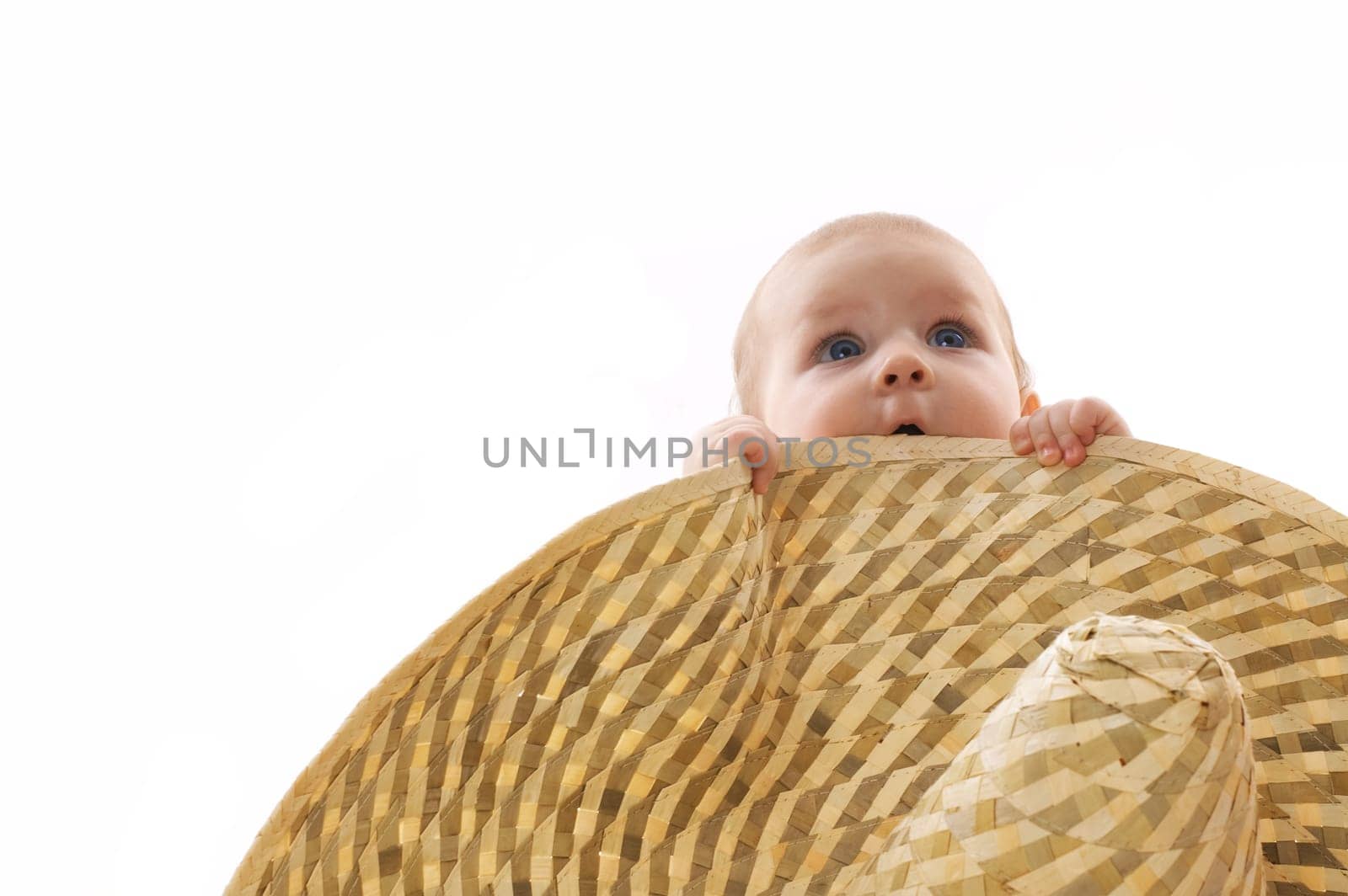 little baby hidden behind a big hat, portrait, Isolated on white