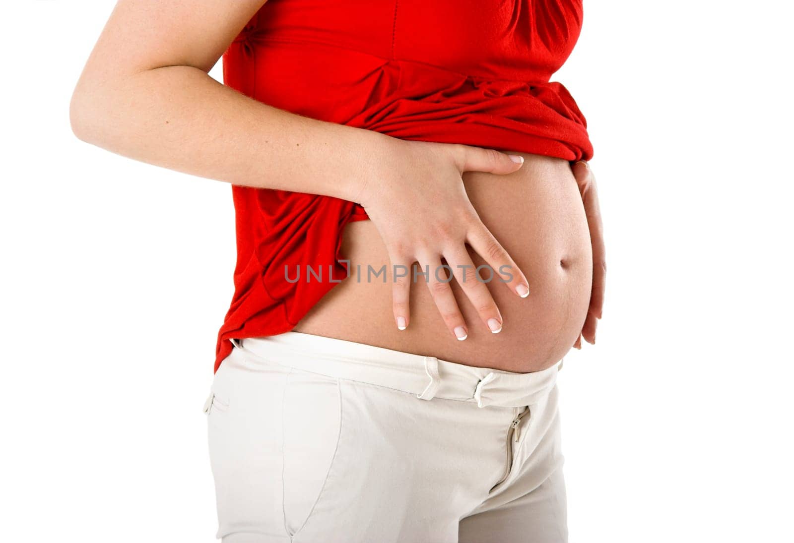 Beautiful pregnant woman showing her big tummy
