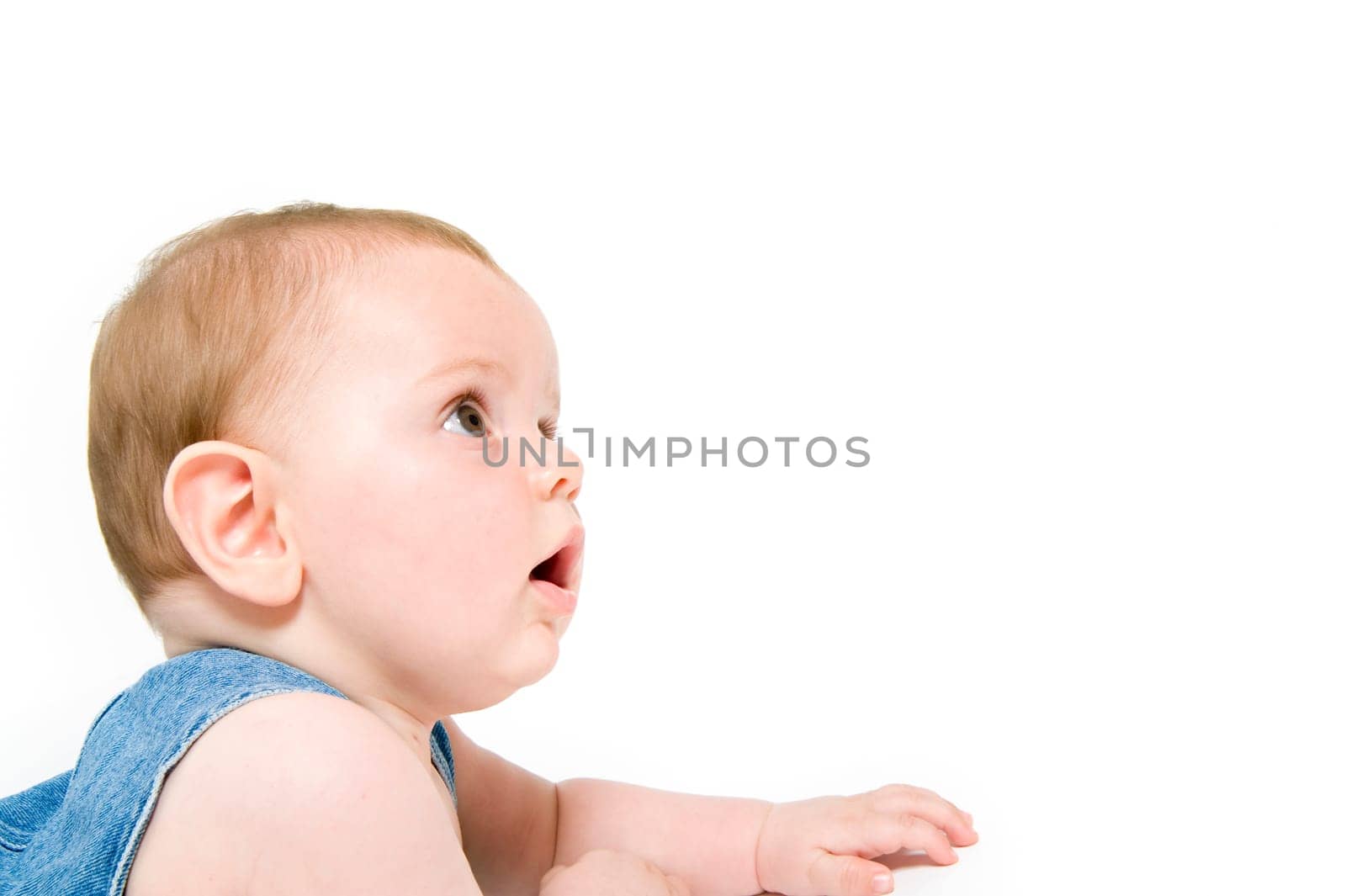 six month old baby wearing jeans overall isolated on white