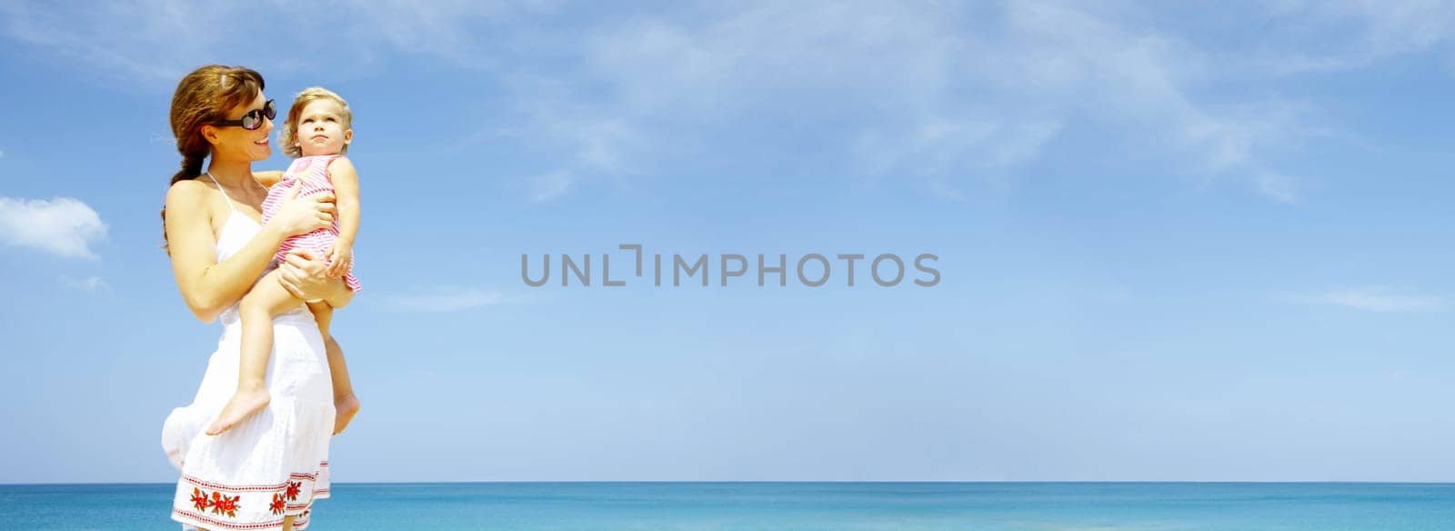 portrait of young happy mother holding her  baby . banner, lots of copy space