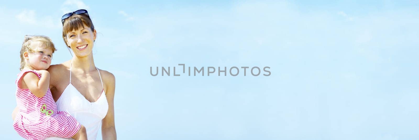 portrait of young happy mother holding her  baby . banner, lots of copy space