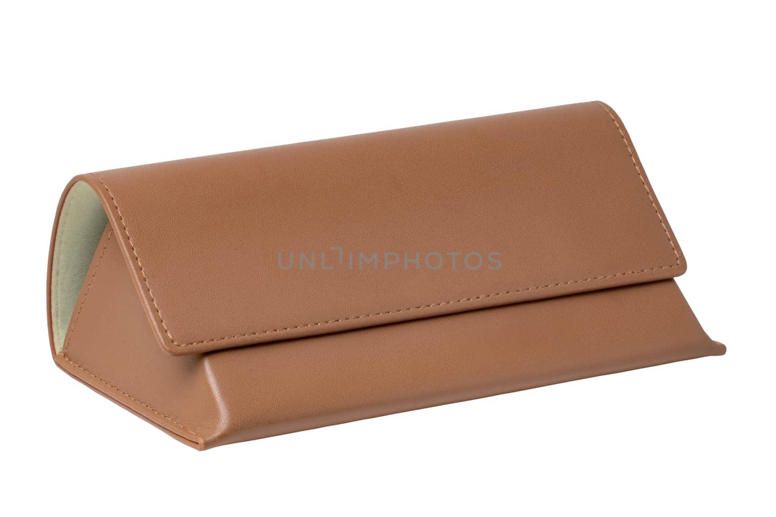 Close-up of a trendy closed brown leather case for the eyeglasses or glasses isolated on a white background. Clipping path. Macro. Protection for sunglasses.