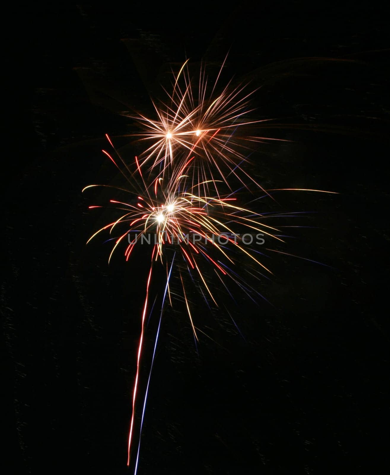 Four simultanious fire work explosions and lots of copyspace
