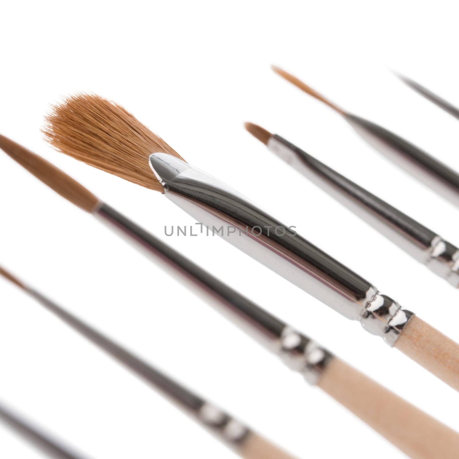 A collection of paintbrushes with different tips, ideal for various painting techniques and artistic creations, displayed on a white background.