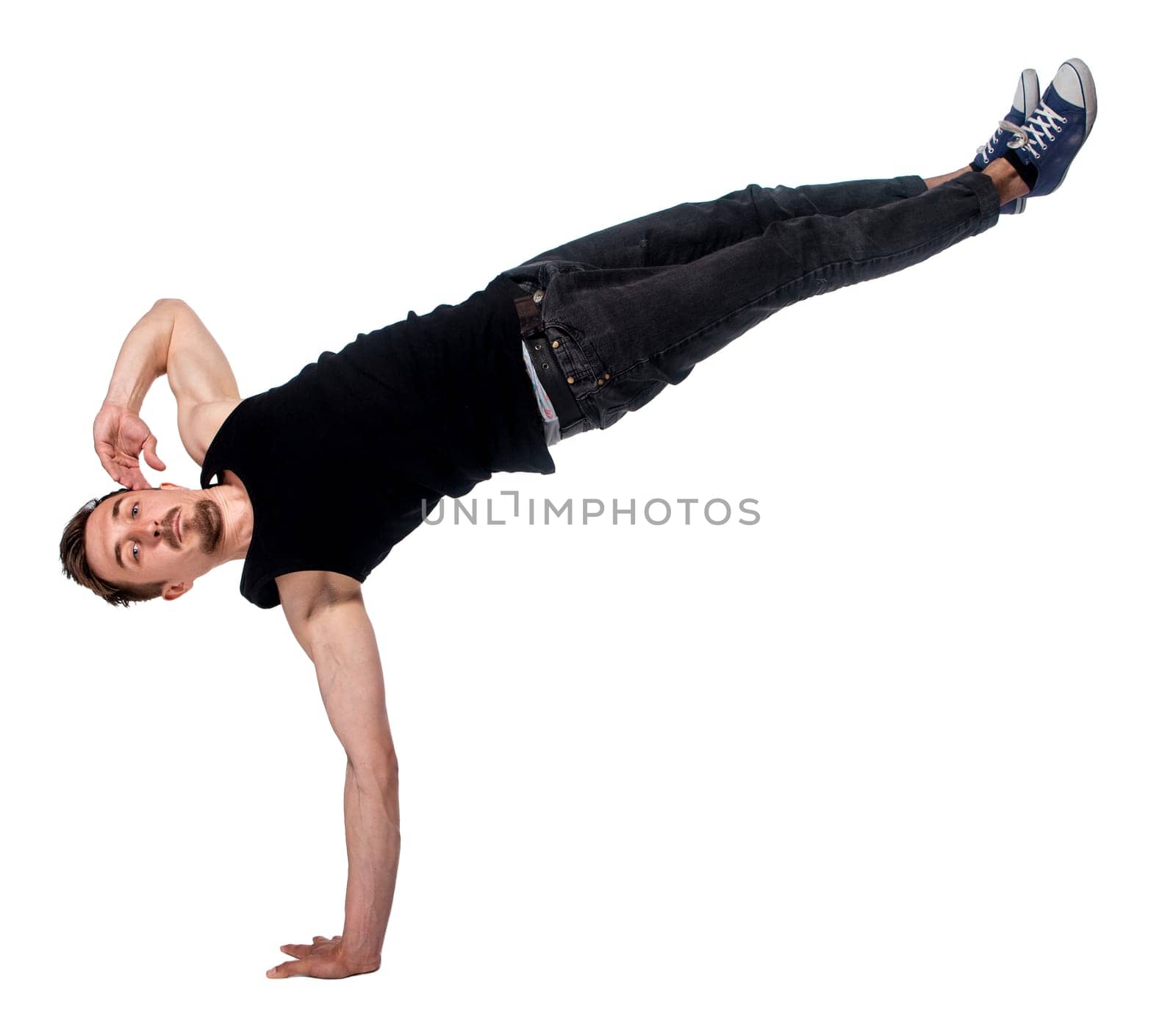 Break dancer doing an one handed handstand against a white background