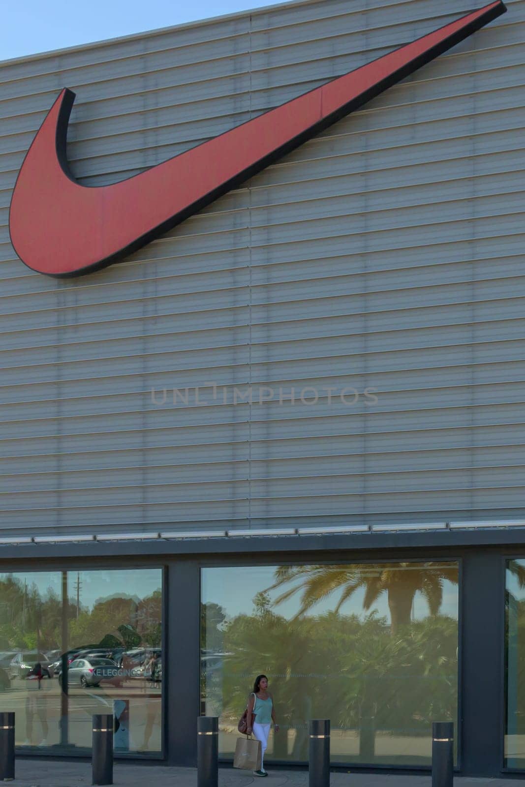 mallorca, balearic islands spain-november 05 2022: woman shopping in Mallorca Fashion Outlet, shopping center sports store nike