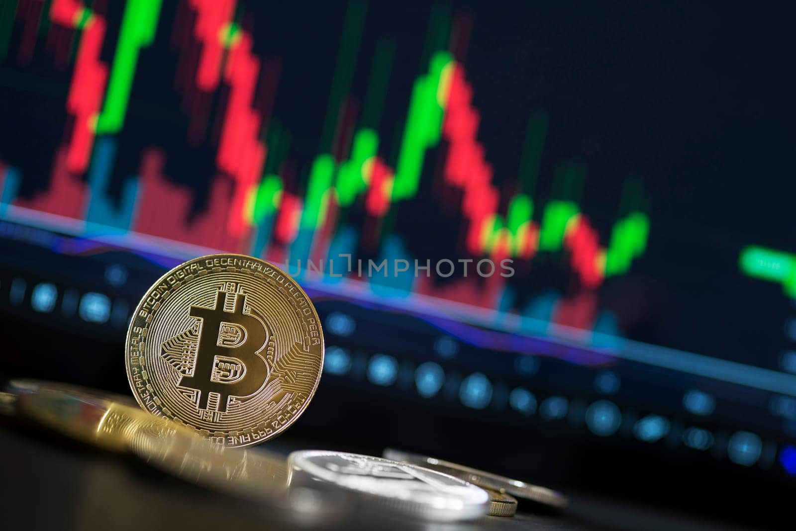 Bitcoin and cryptocurrency investing concept. Bitcoin cryptocurrency coins. Trading on the cryptocurrency exchange. Trends in bitcoin exchange rates. Rise and fall charts of bitcoin.