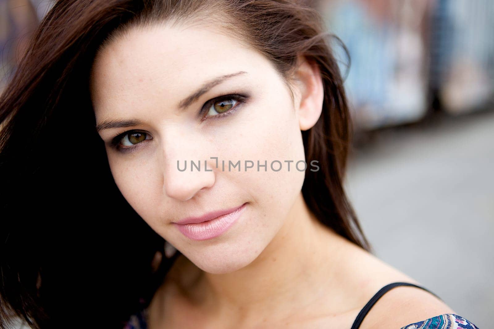 Beautiful Brunette with an edge and darker eye makeupA Sexy Brunette Looking Toward The Camera with an edgy look
