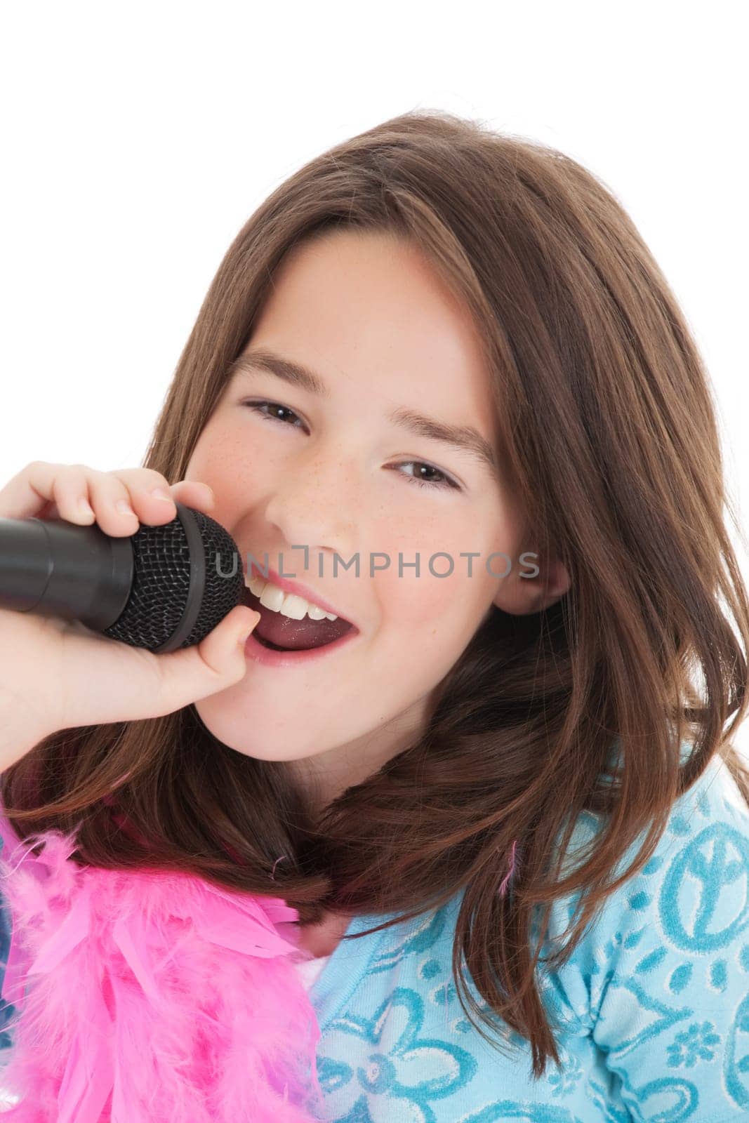 Caucasian children singing karaoke on a white background