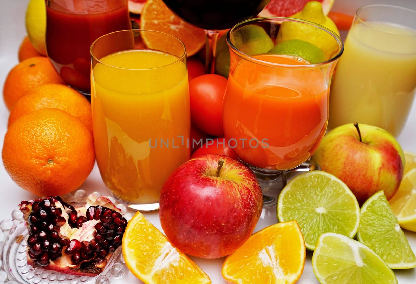 Healthy fruit and vegetable juices on a white background