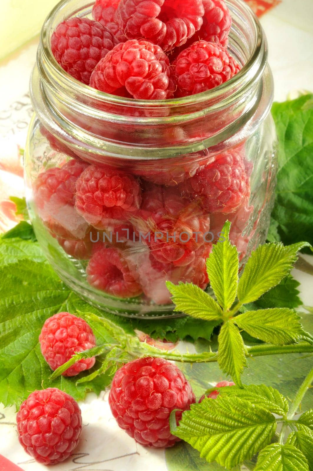 raspeberries in a glass, ingredients for jam
