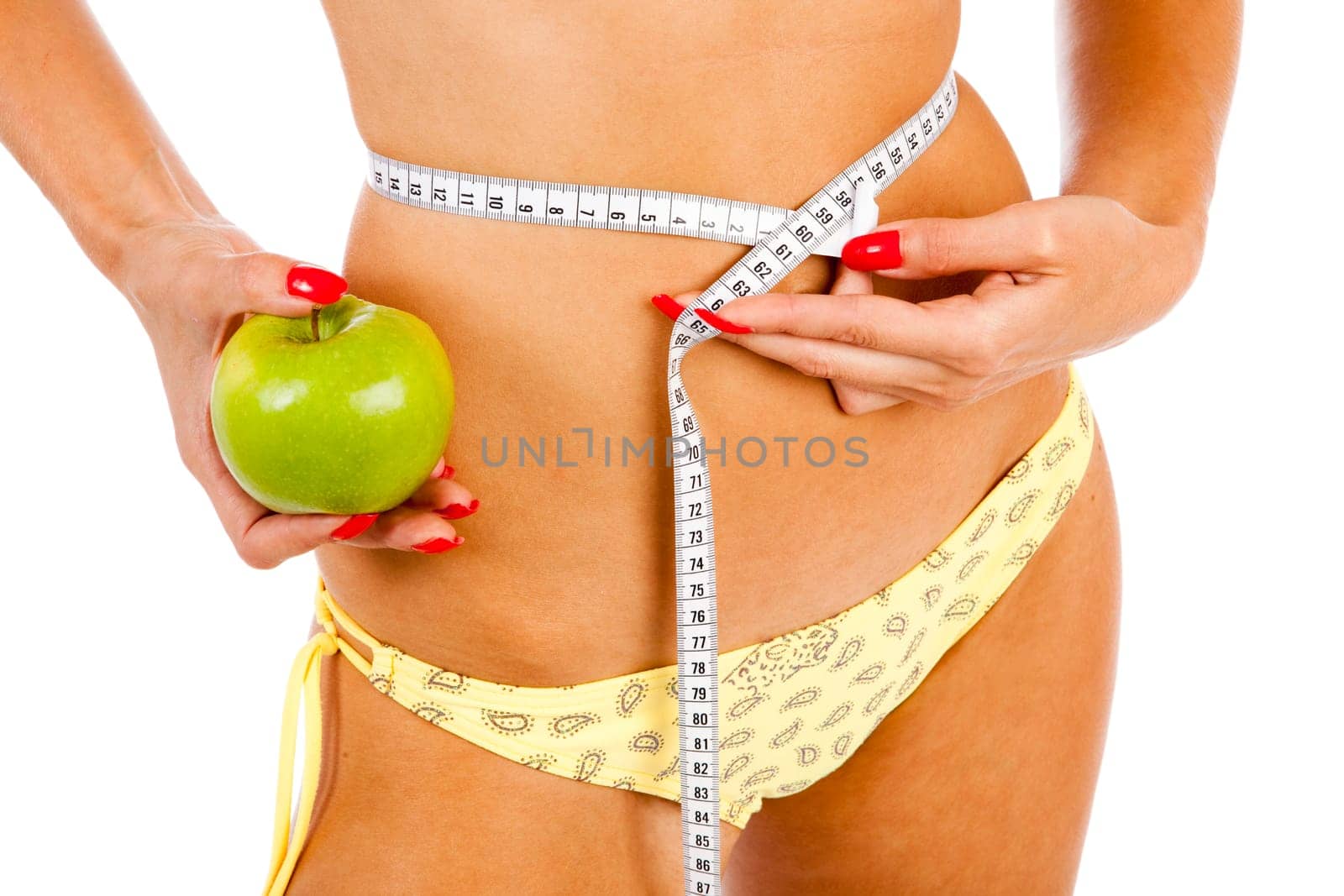 young pretty blond woman controls her waist