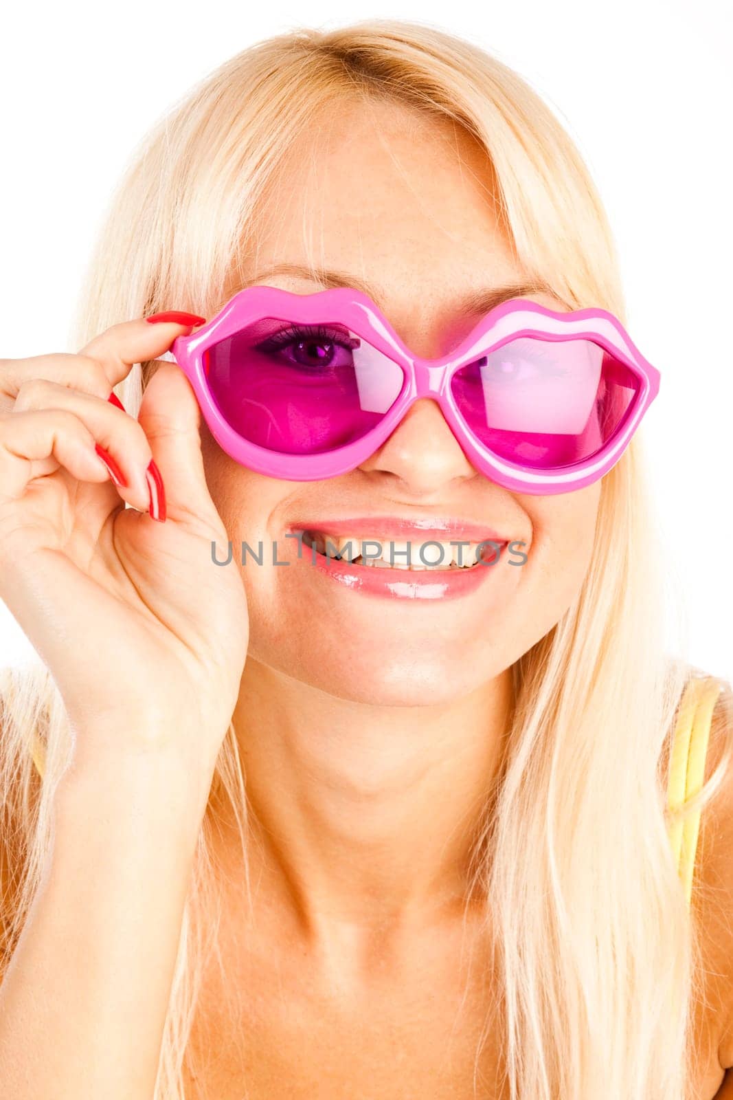 pretty blonde  woman in yellow bikini and rose sunglasses