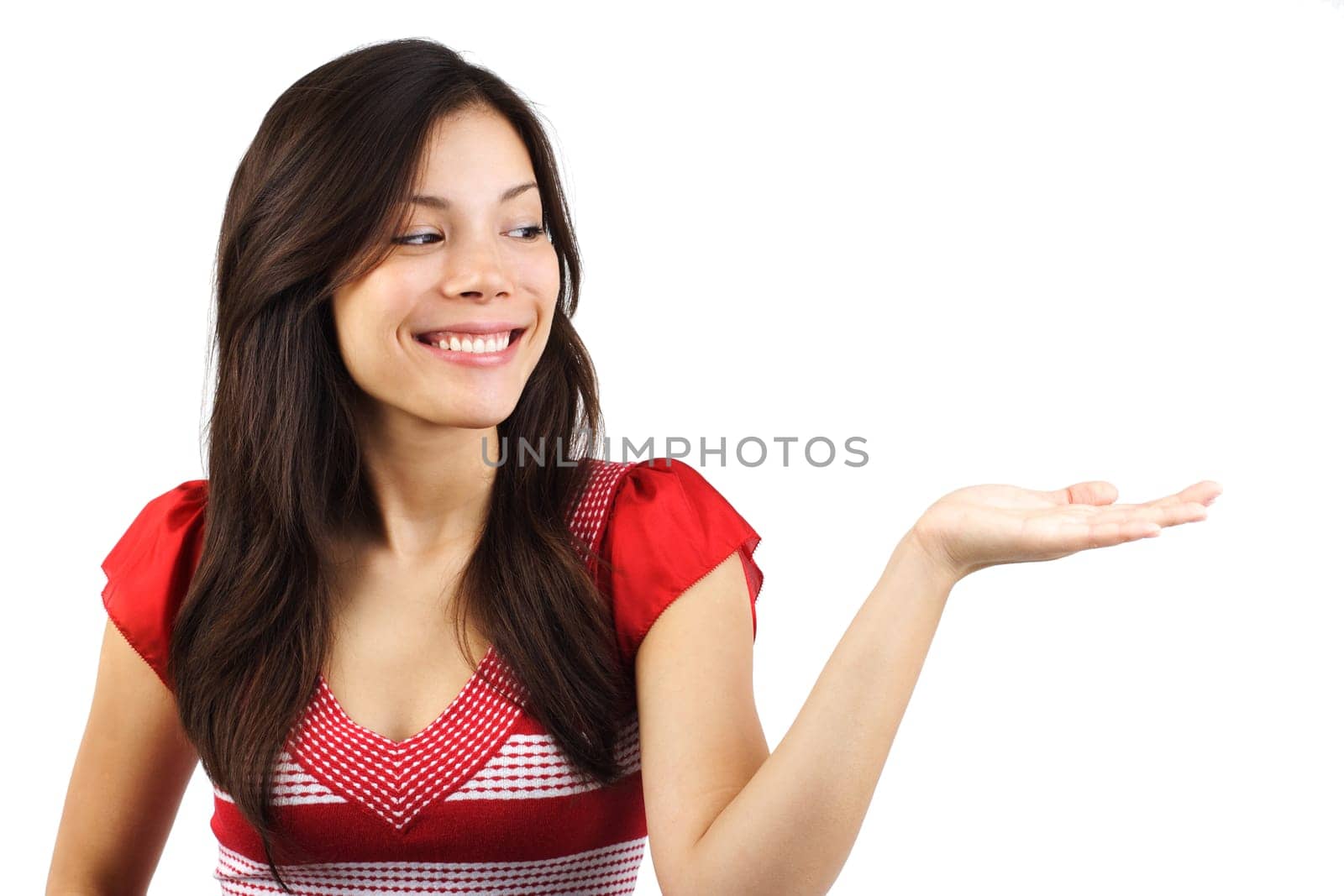 Beautiful young eurasian woman presenting your product. Isolated on white background.