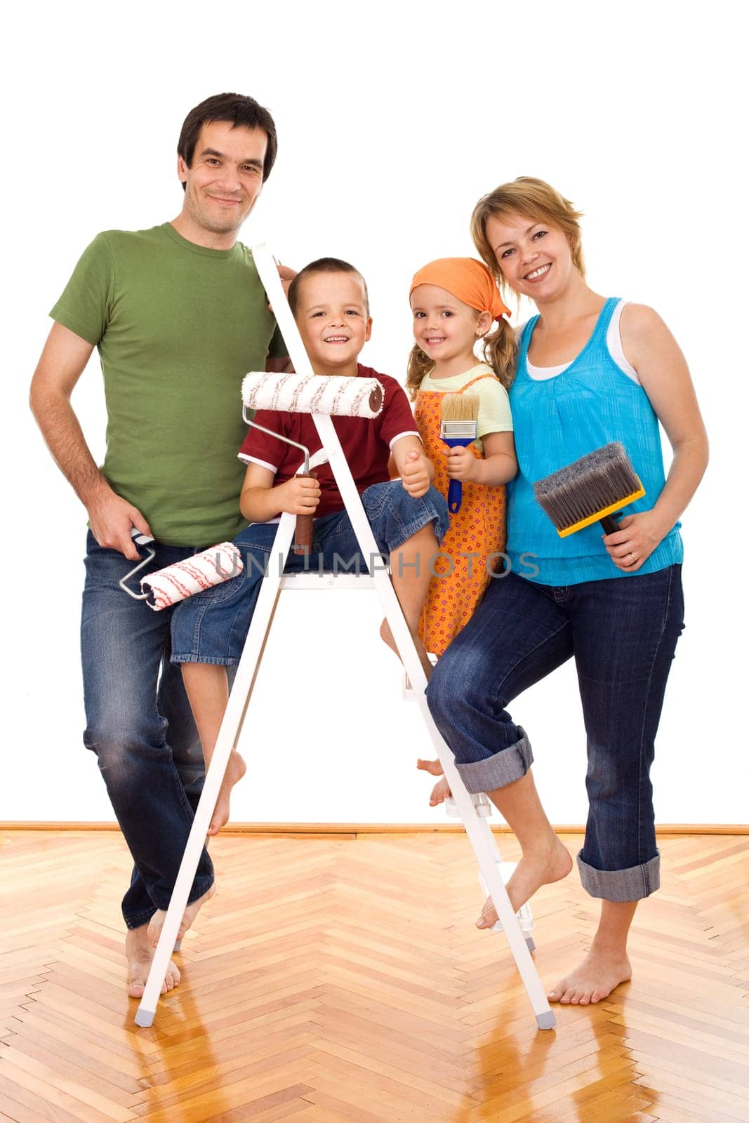 Happy family with painting utensils ready to repaint their home - isolated