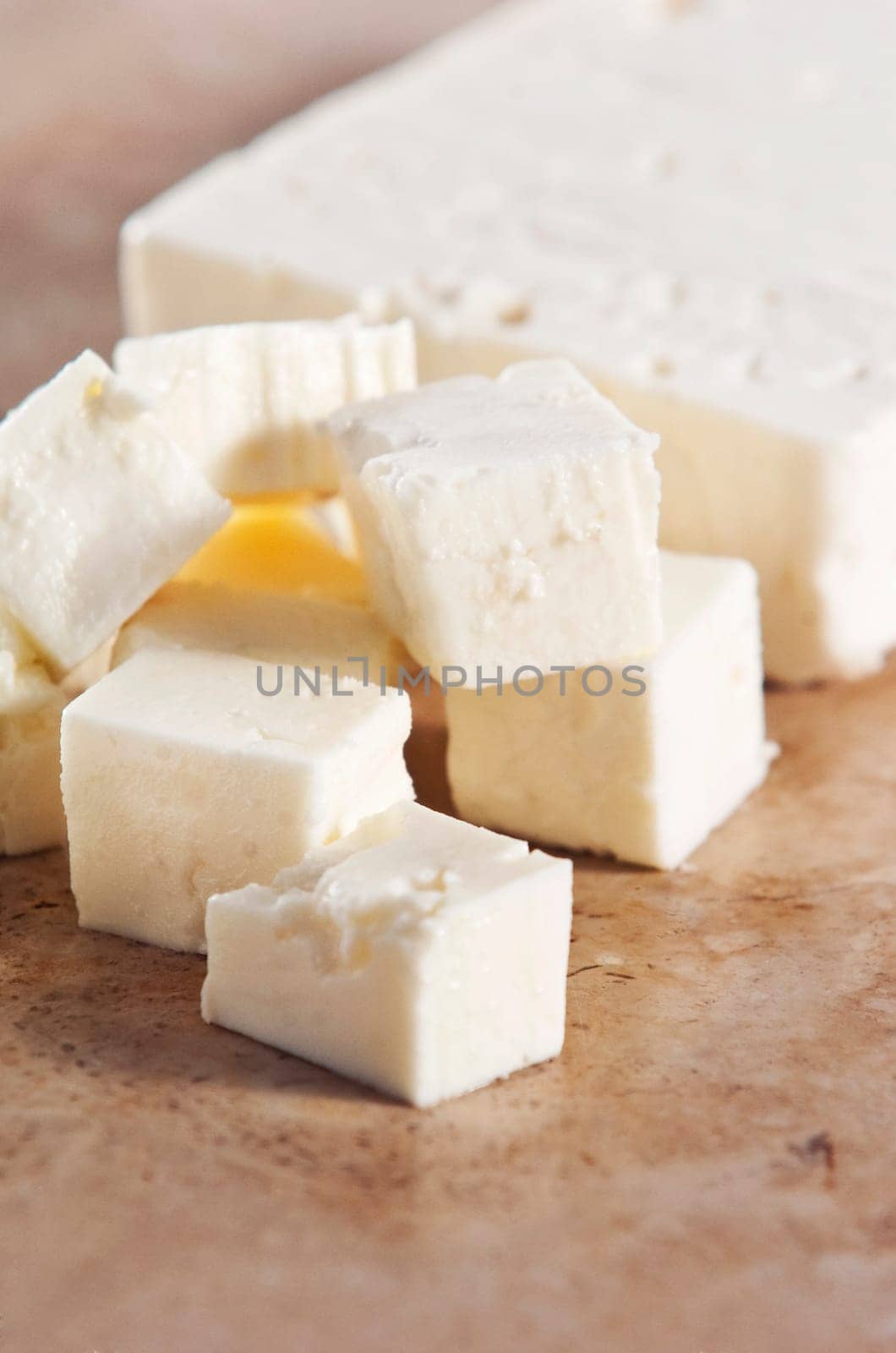 Cubed feta cheese on a kitchen counter