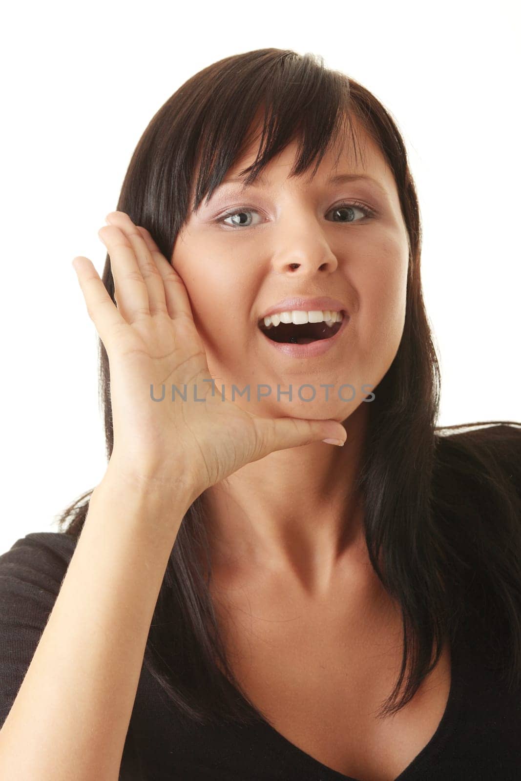 Portrait of a beautiful young shouting woman against white background.