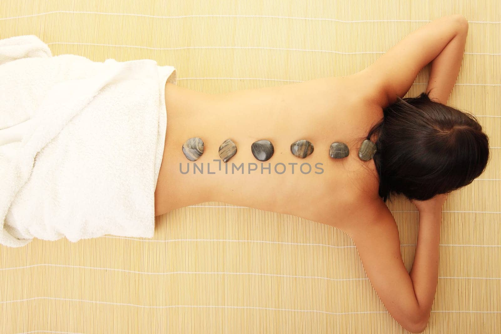 Attractive woman getting spa treatment isolated on white
