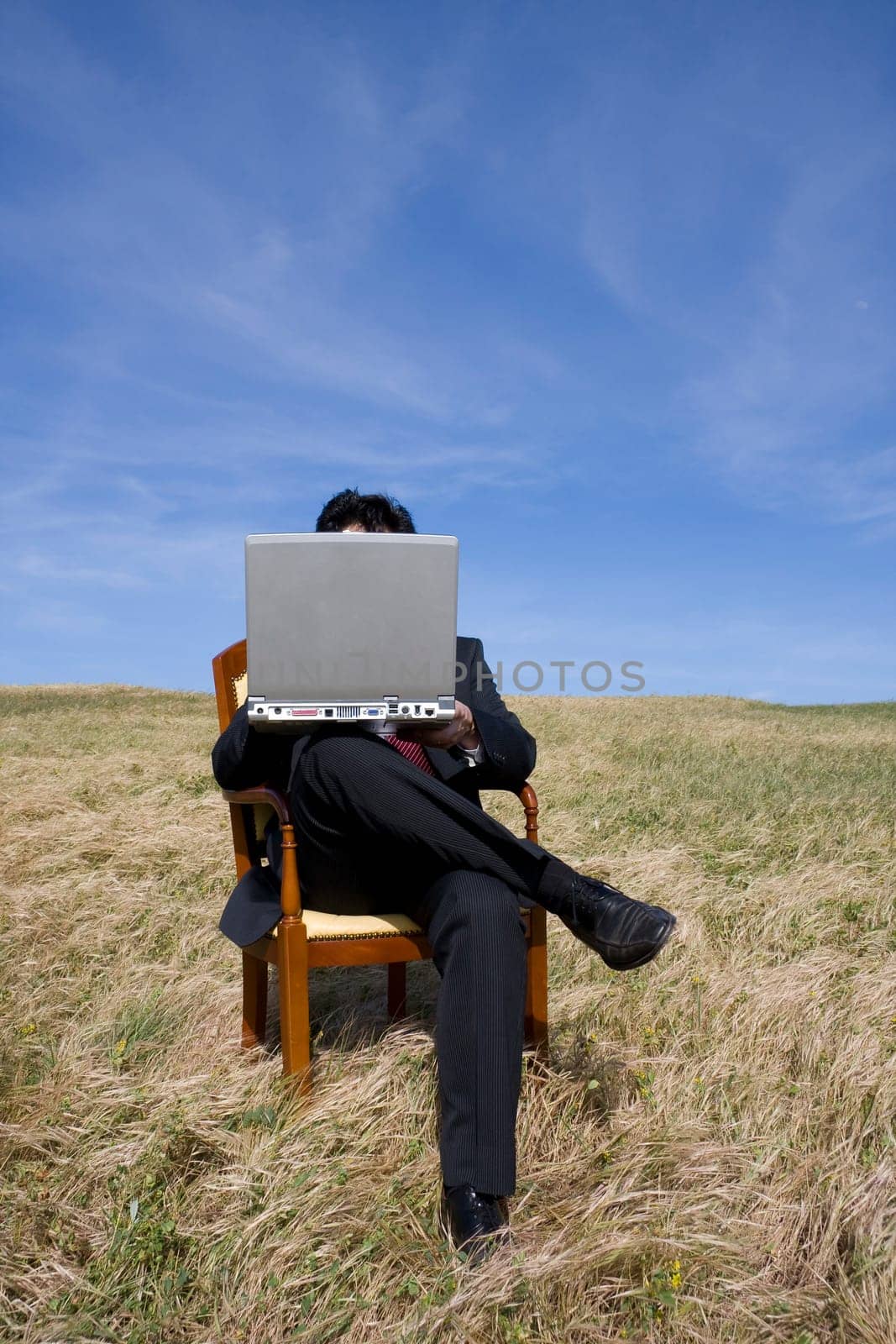 Business man sitting on a chair working out
