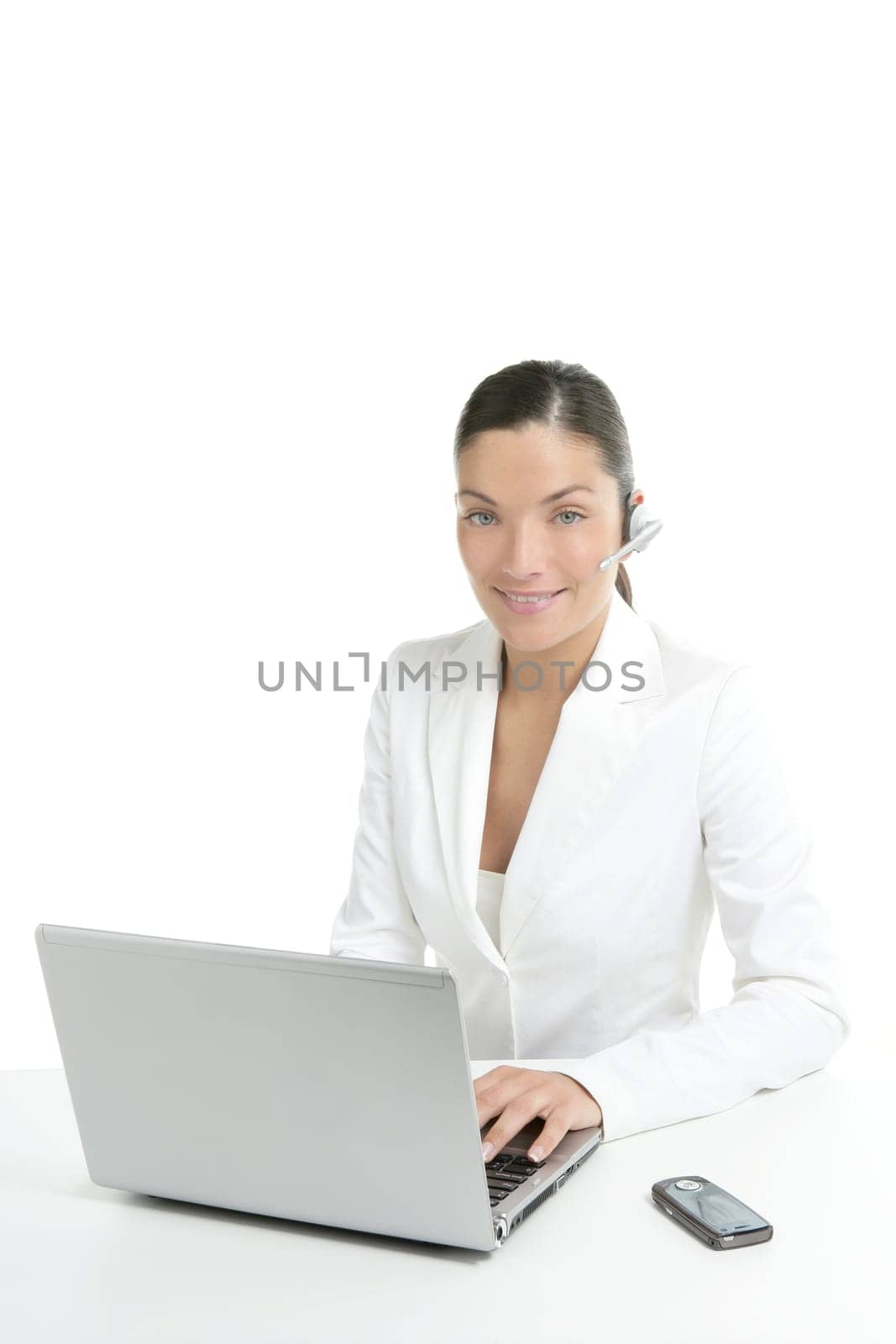 Beautiful businesswoman with headset telephone in white background