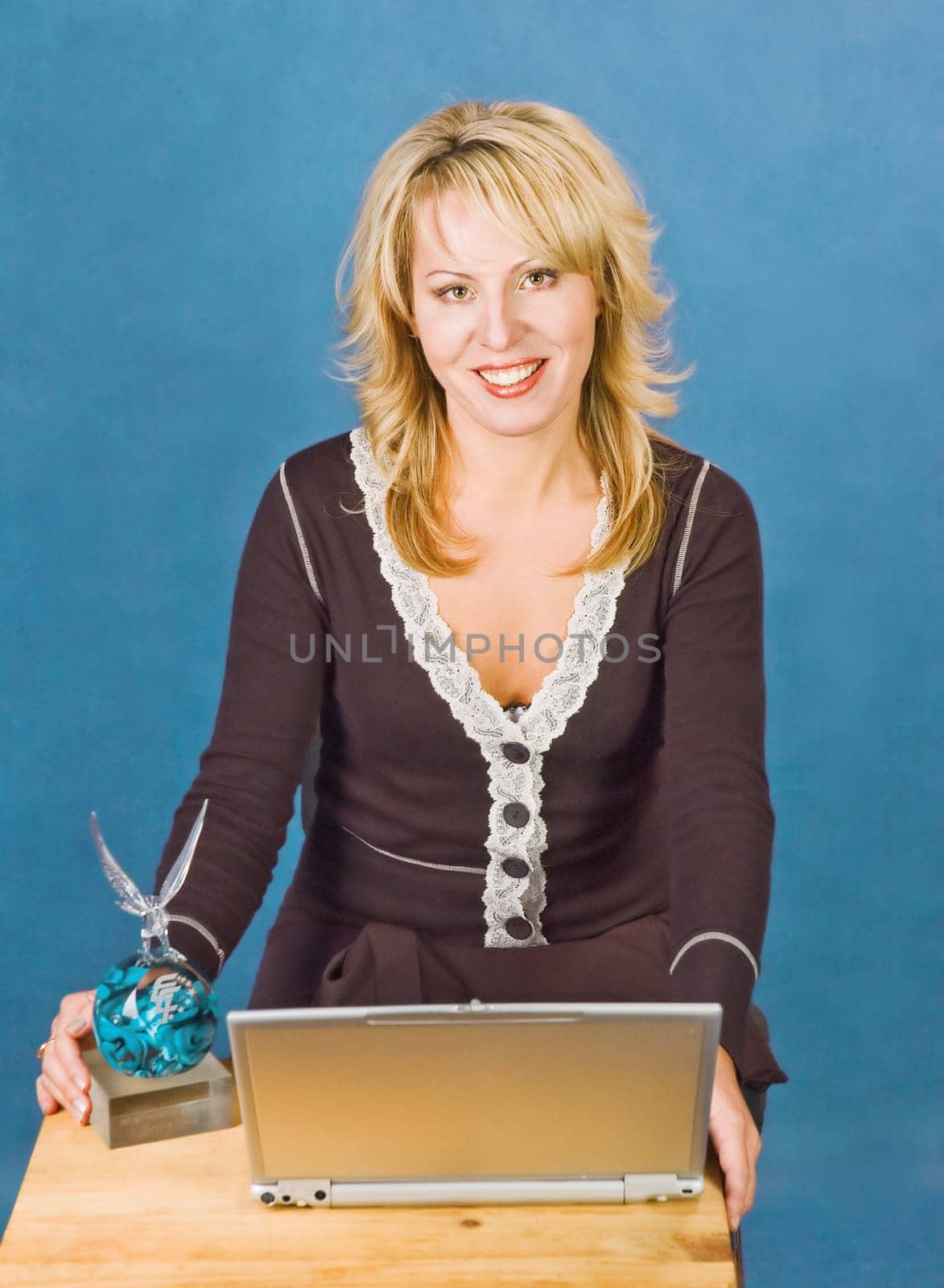 attractive smiling businesswoman with  cup and laptop