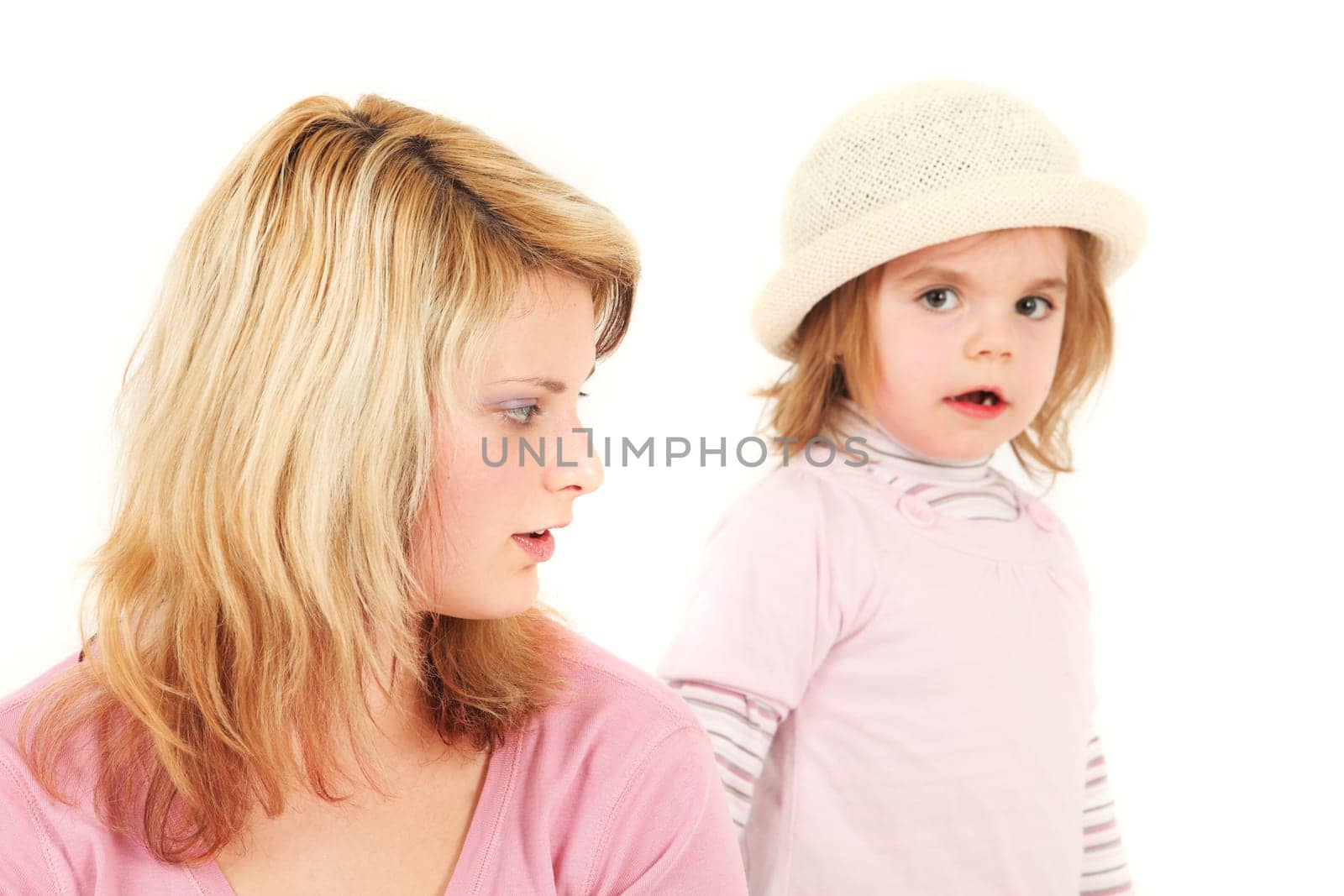 Portrait of young mother and daughter, studio shot