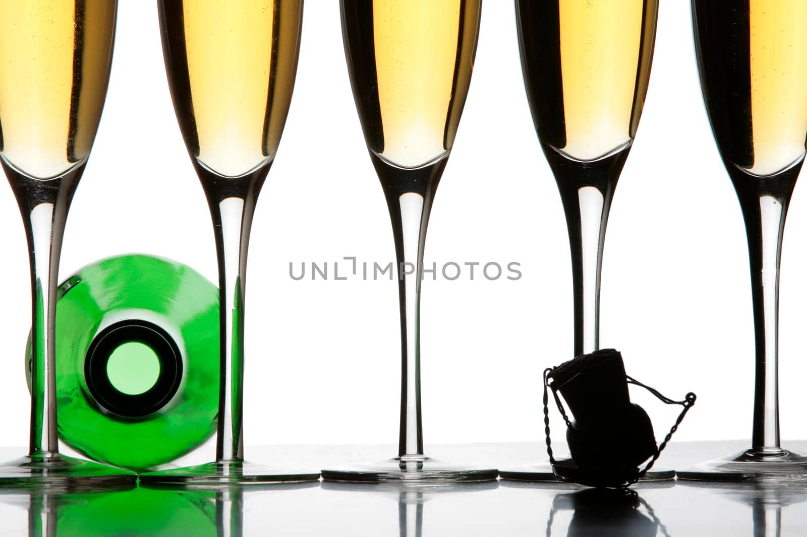 Two champagne glasses and a bottle in silhouette