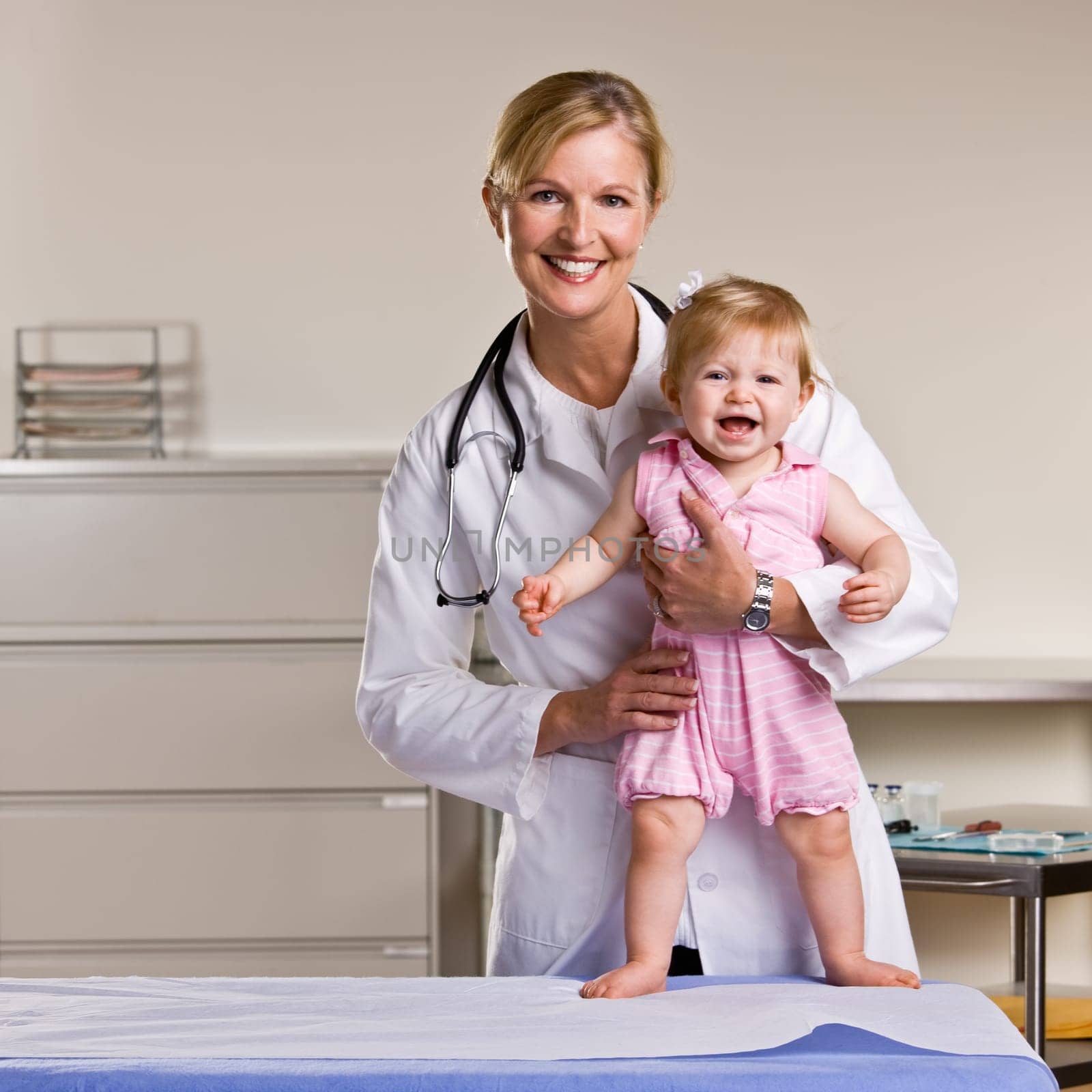 Doctor and baby girl in doctor’s office