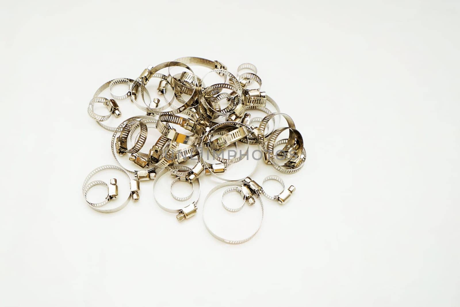 New stainless steel hose clamps isolated on white background