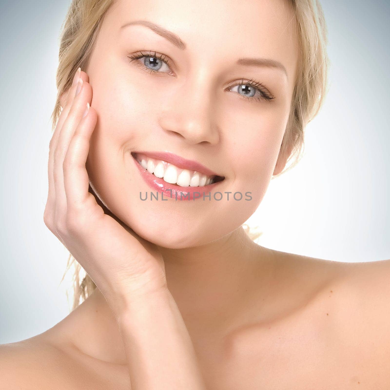 beautiful girl with pretty smile on blue gradient background
