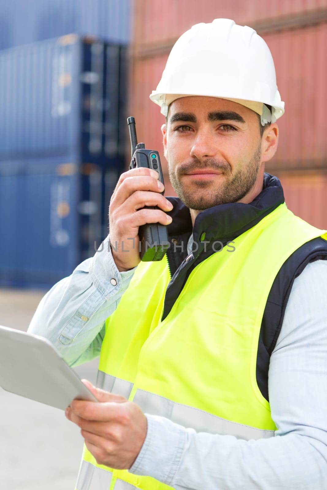 View of a young Attractive docker using tablet at work
