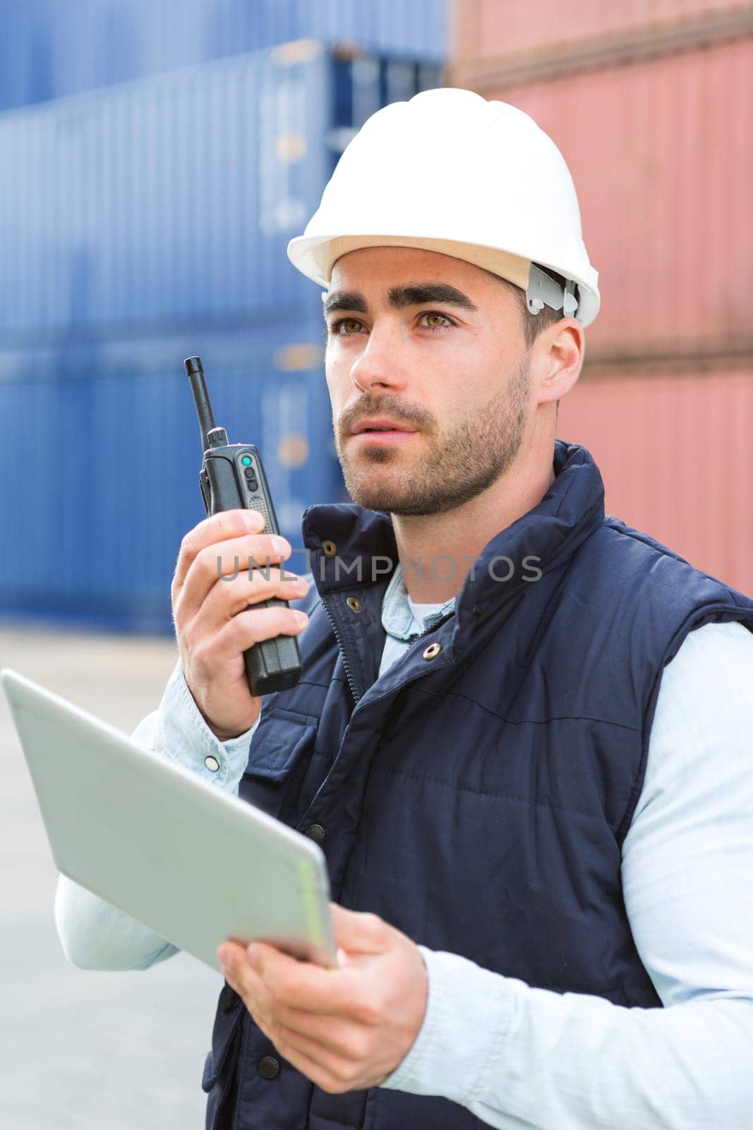 View of a young Attractive docker using tablet at work