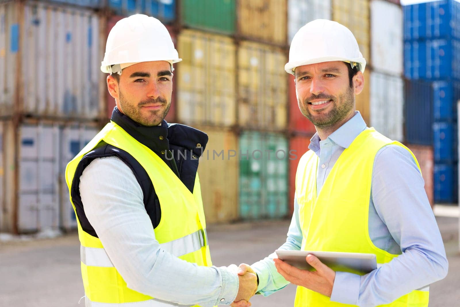 View of a Docker and supervisor handshaking in front of containers