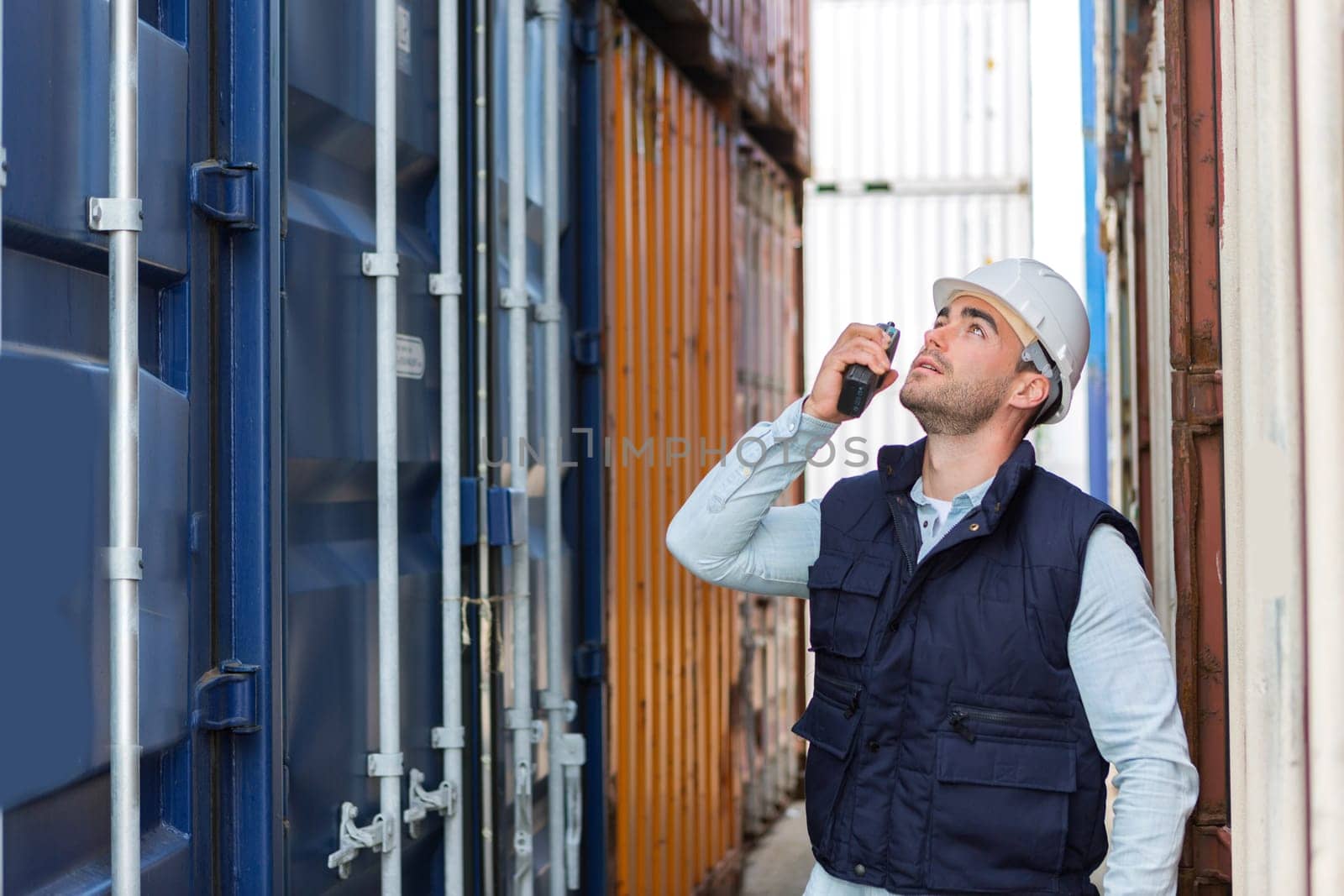 View of a Young attractive docker checking security system