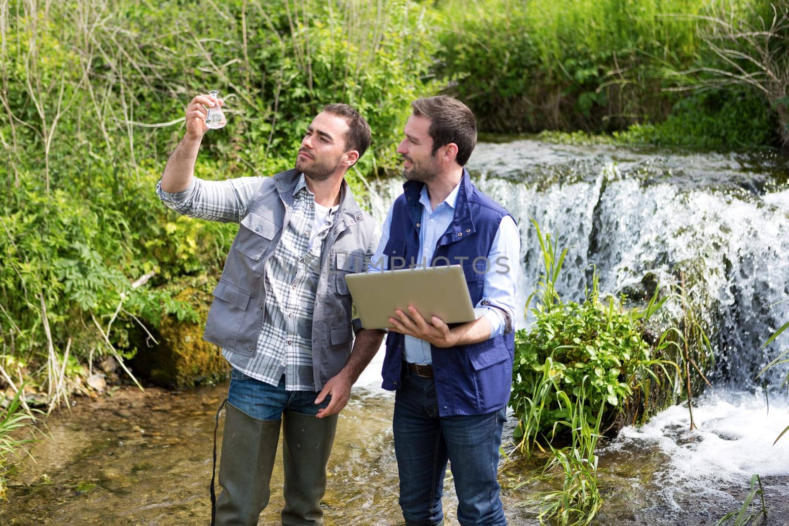 View of a Scientist and biologist working together on water analysis