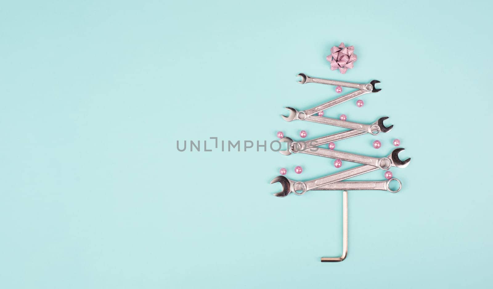 Christmas tree made with wrenches, baubels and a star, new year greeting card with repair tools