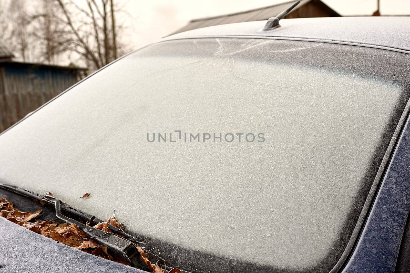 frozen windshield of a passenger car in winter. High quality photo