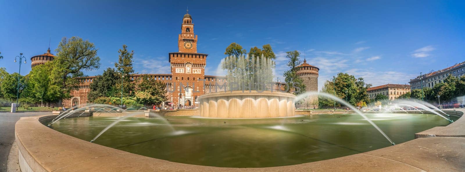Panoramic view of Castello Sforzesco square with fountain in Milan, Italy. Long Exposure.
