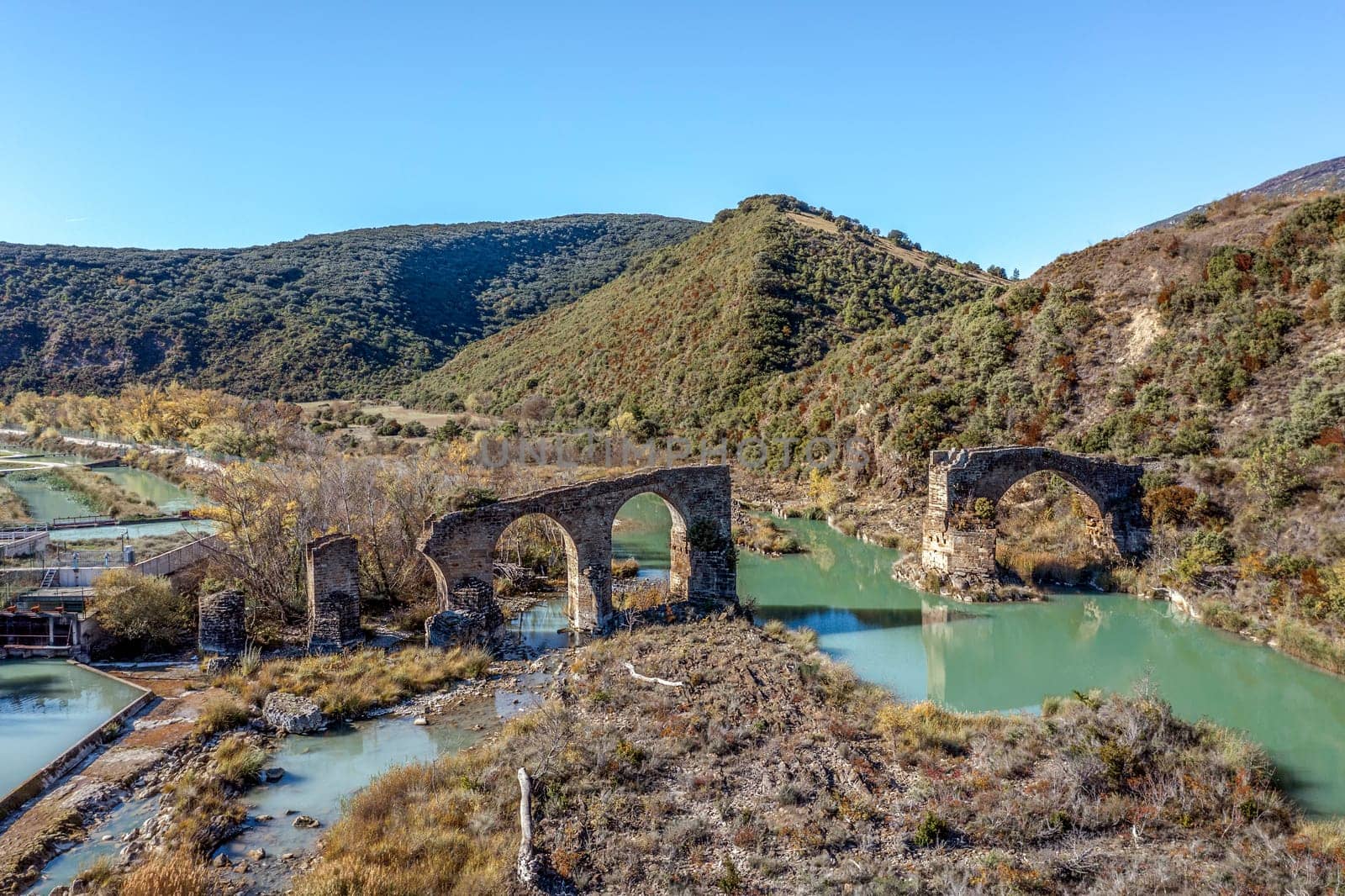 Roncalese bridge, Medieval construction, with seven arches, semi-ruined, located over the Aragón river near the town of Yesa, next to the fish farm. It has been part of the Camino de Santiago