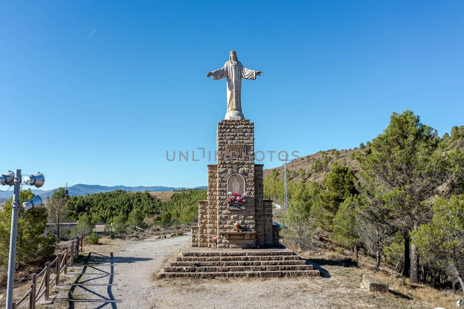 Sanguesa, Spain - November 10, 2022: In 1945 the Sacred Heart of Jesus was consecrated to Sanguesa. Sculptor work Jose Larrea Echeniz, base of 8 m. by the architect Salvador Gayarre