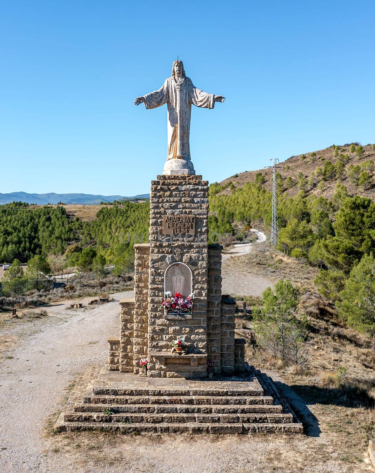 Sanguesa, Spain - November 10, 2022: In 1945 the Sacred Heart of Jesus was consecrated to Sanguesa. Sculptor work Jose Larrea Echeniz, base of 8 m. by the architect Salvador Gayarre