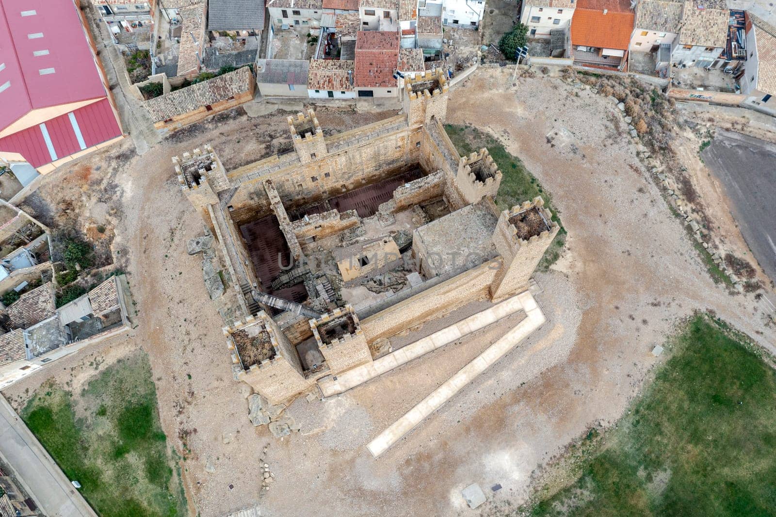 The castle of Sadaba on the rock on top of a small hill, in the region of Cinco Villas, Zaragoza, Aragon Spain Aerial top view