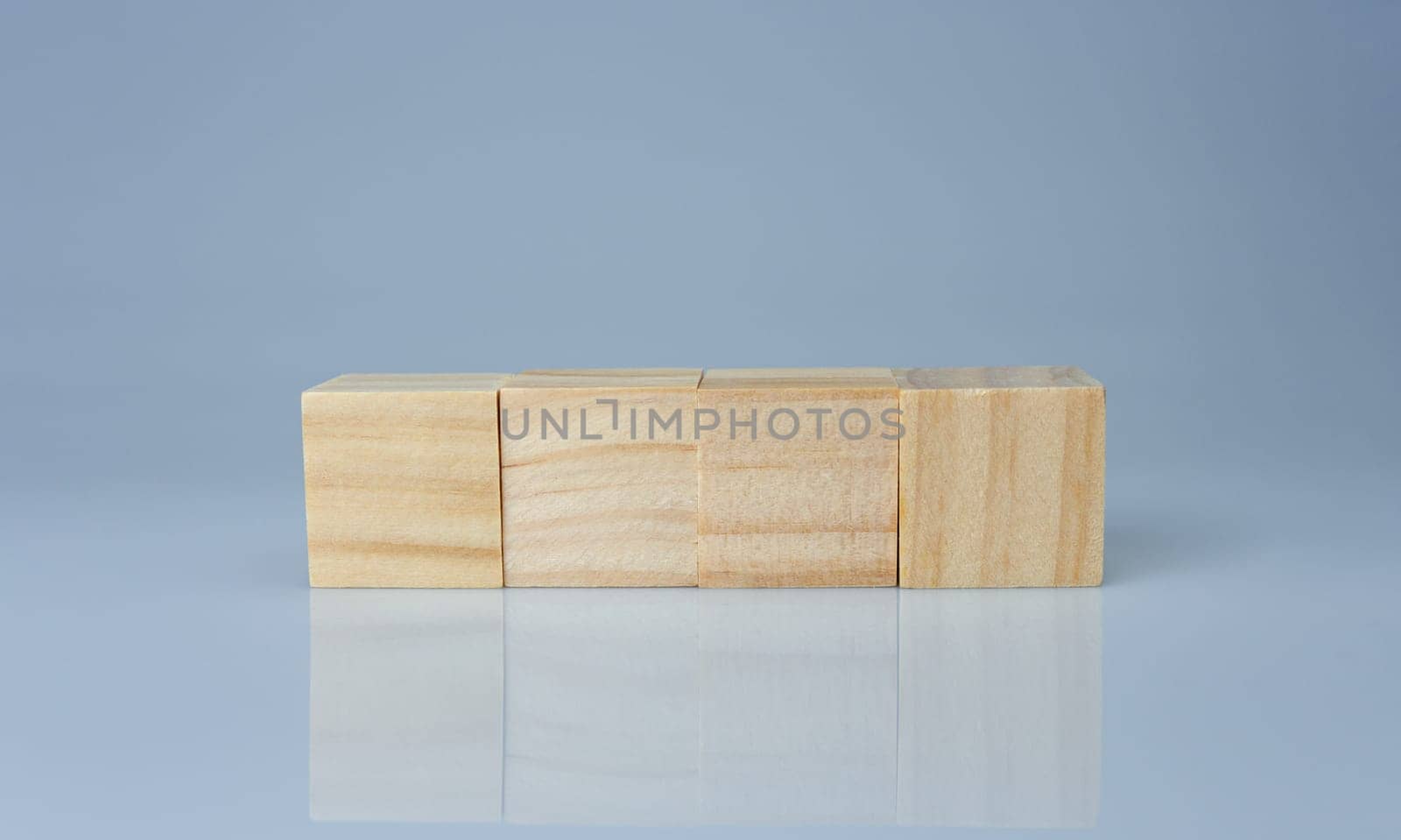 empty wooden blocks lined up on a white background. Business concept.