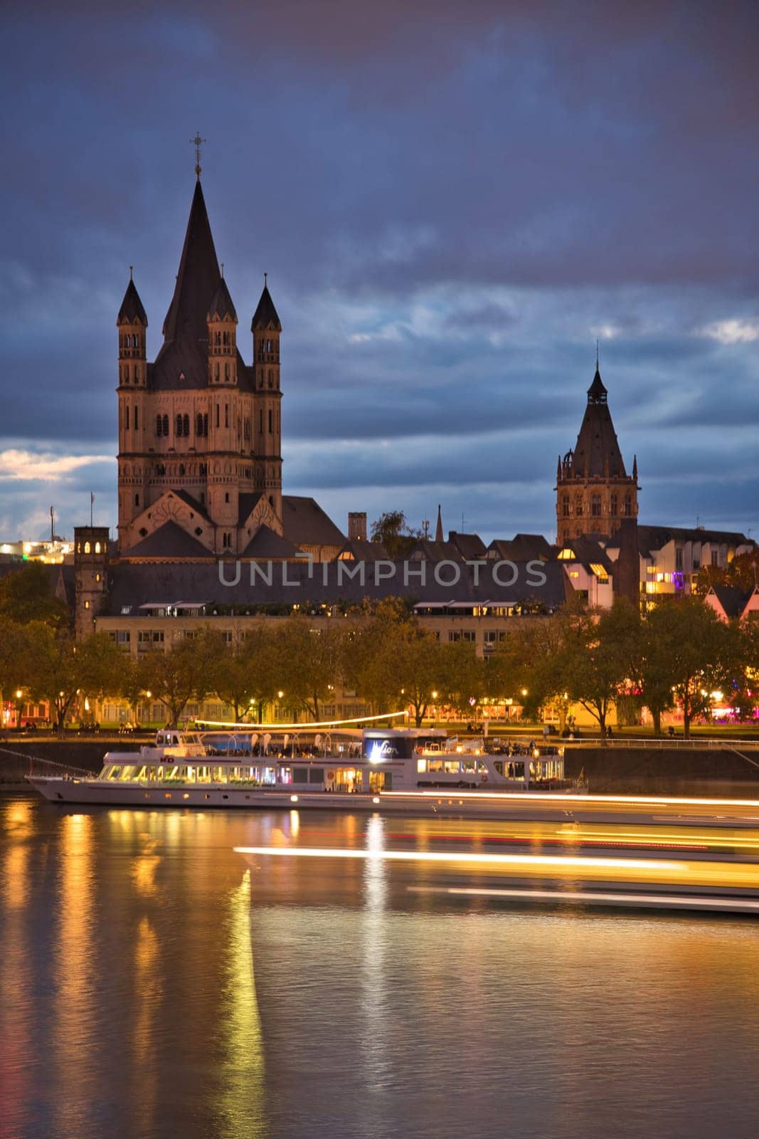 Church Great St. Martin by night with lots of lights in Cologne, Germany