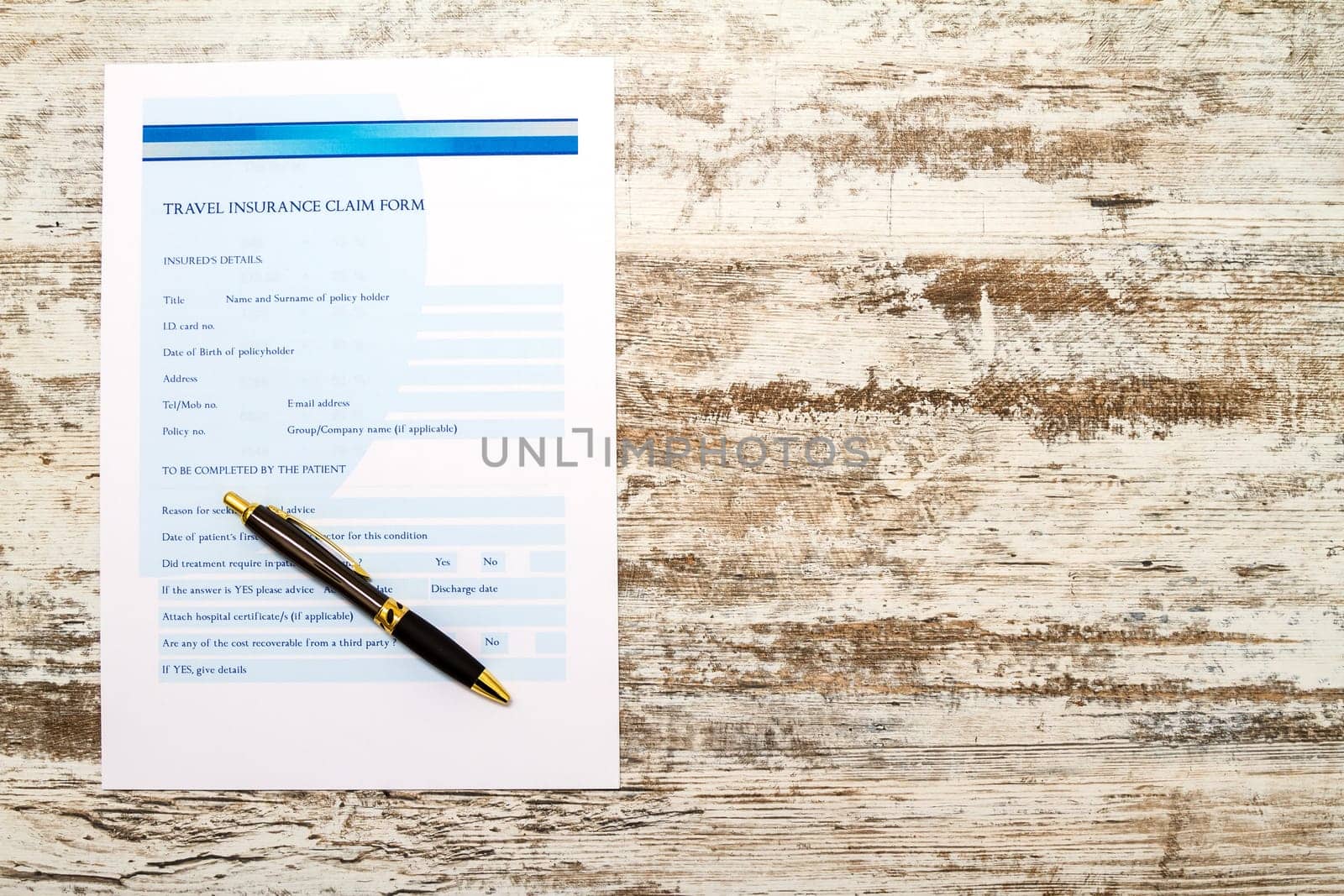 Travel insurance application form with a boarding pass and a passport.