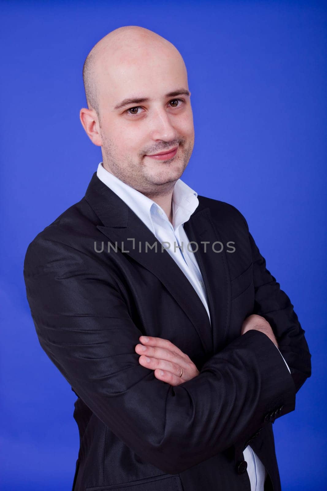an young man portrait over a blue background