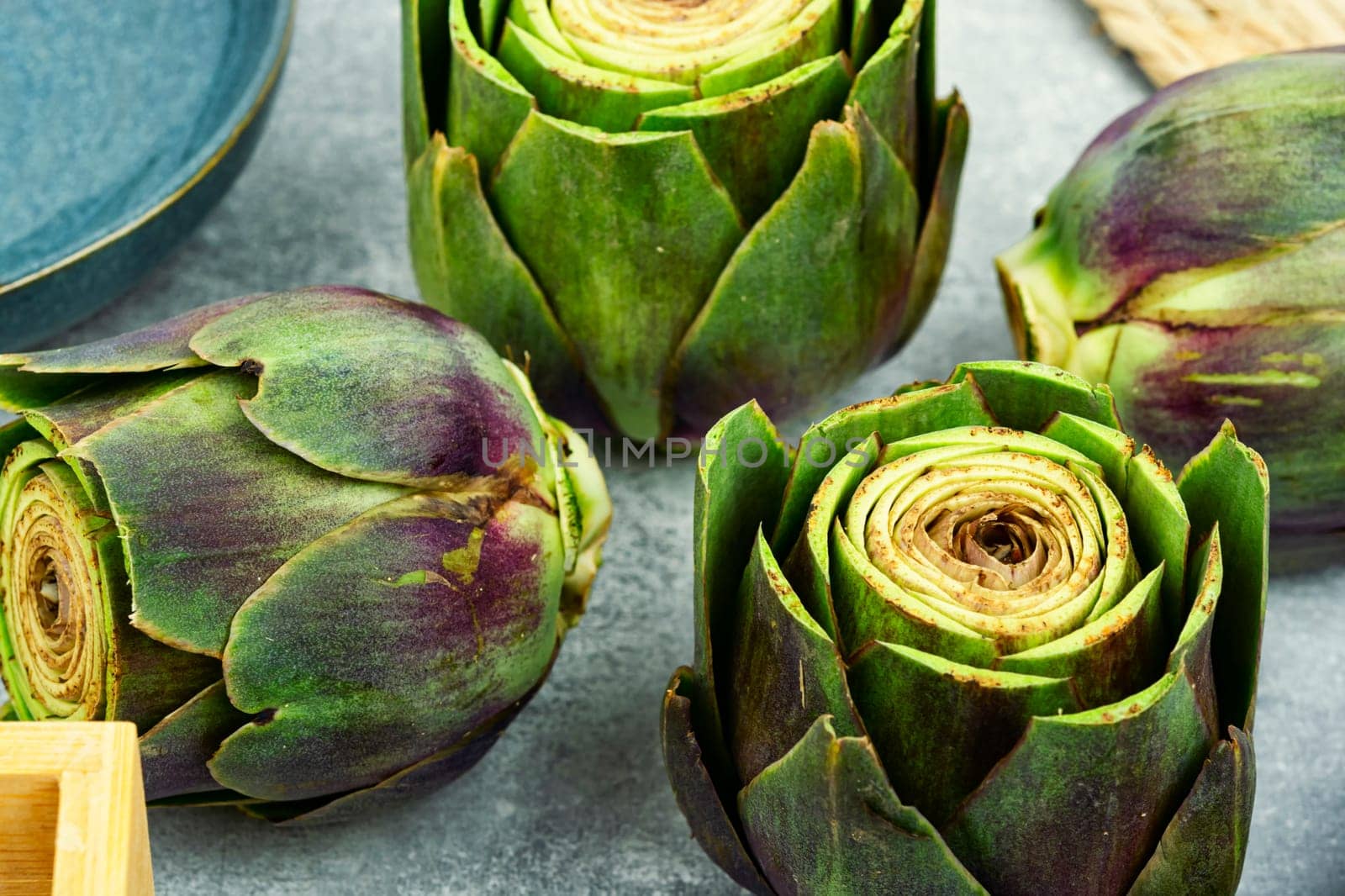 Uncooked unopened artichoke buds, food. Italian cuisine