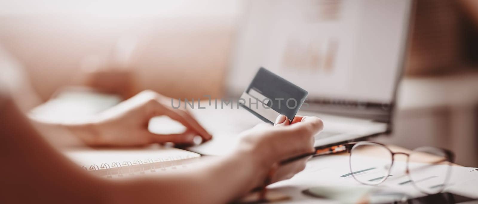 Woman at office trying to moke e-pay. Concept of e-commerce and office at home.