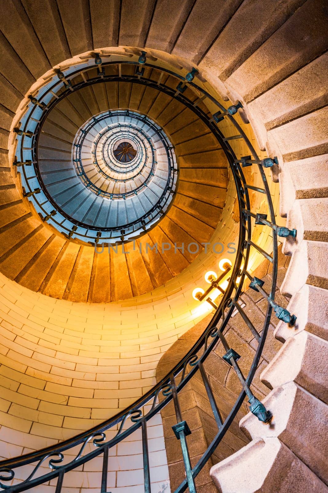 Penmarch, France - August, 11 2017 : Vertical view of spiral staircase inside the Eckmuhl lighthouse in Brittany, France